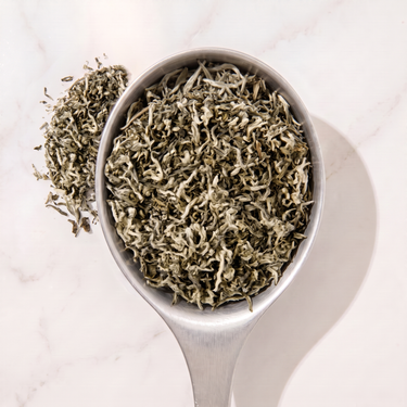 100 Monkeys Chinese White Tea in a measuring scoop