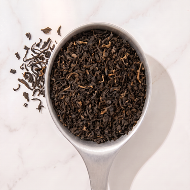 Assam Gingia Black Tea in a measuring scoop