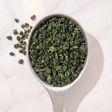 Si Ji Chun Oolong Tea in a measuring scoop