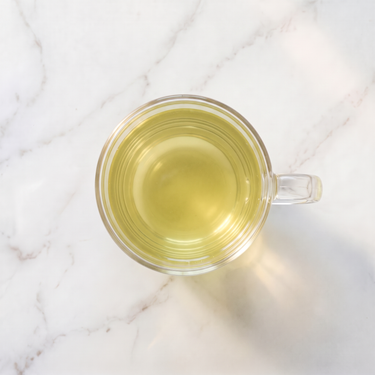Gyokuro Green Tea brewed infusion in a glass cup