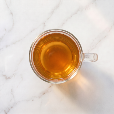 Formosa Oolong Tea brewed infusion in a glass cup