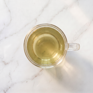Genmaicha Green Tea brewed infusion in a glass cup