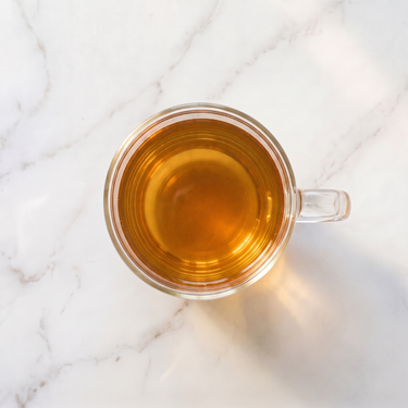 Ginseng Oolong Tea brewed infusion in a glass cup