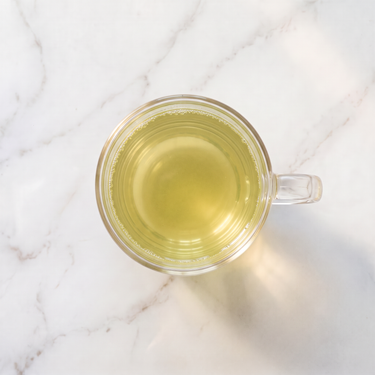 Sencha Isagawa Green Tea brewed infusion in a glass cup