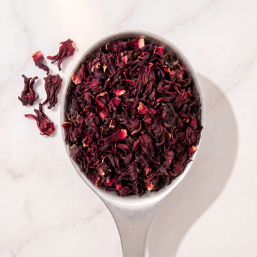 Hibiscus Flower Herbal Tea in a measuring scoop