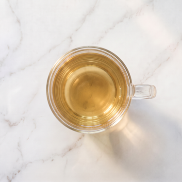 Si Ji Chun Oolong Tea brewed infusion in a glass cup
