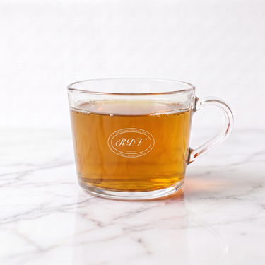 Hojicha Green Tea side view in a branded RDV glass cup