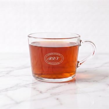 Ginseng Oolong Tea side view in a branded RDV glass cup
