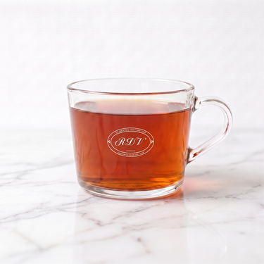 Rukeri Rwandan Black Tea side view in a branded RDV glass cup