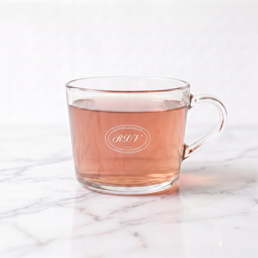 Lavender Flower Herbal Tea side view in a branded RDV glass cup